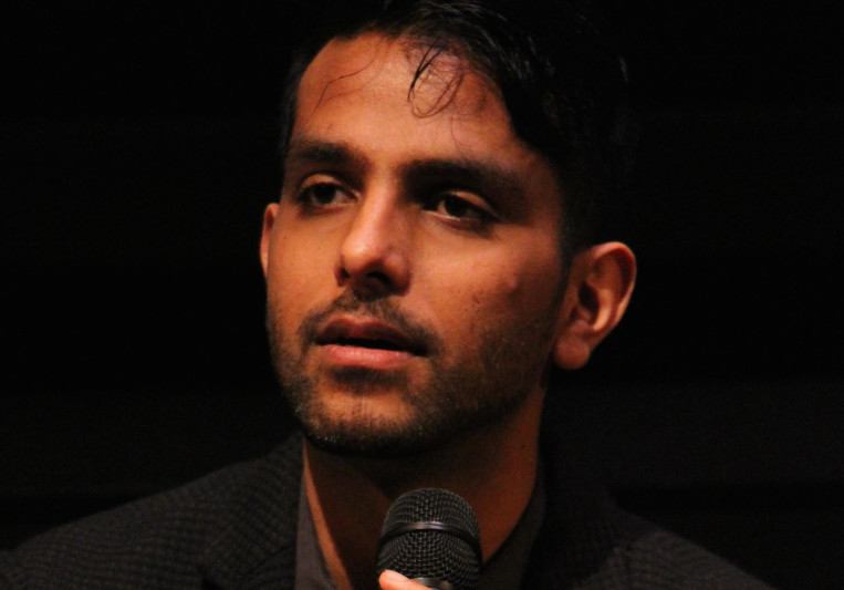 Aditya Virmani holding a microphone